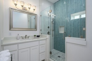 Shower, hair dryer, towels, soap