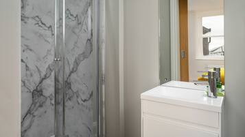 Shower, hair dryer, towels, soap