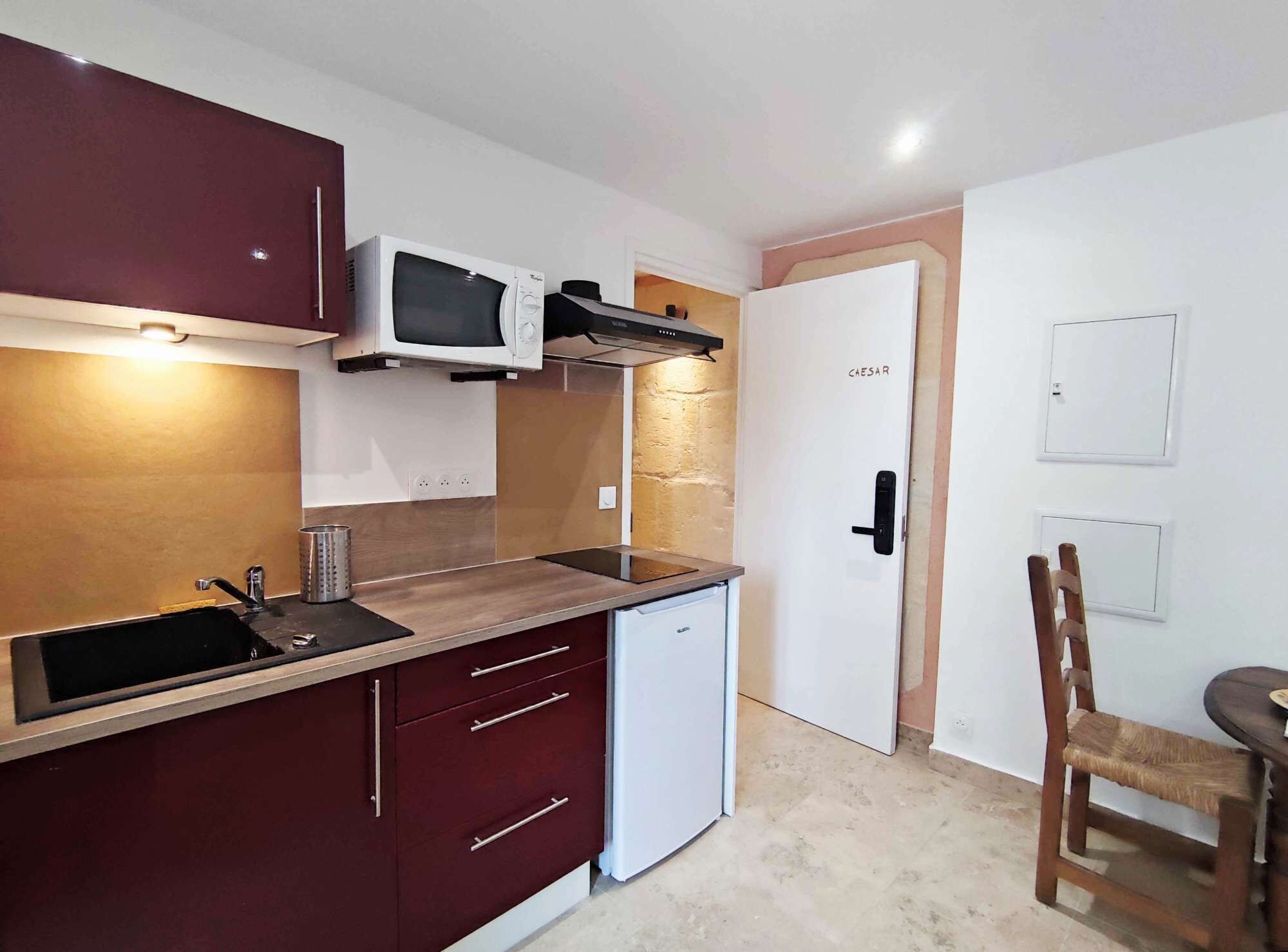 Fridge, microwave, coffee/tea maker, cookware/dishes/utensils