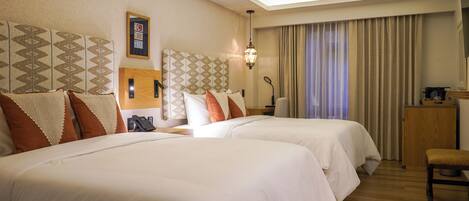 Deluxe Room, Courtyard View | Premium bedding, minibar, in-room safe, desk