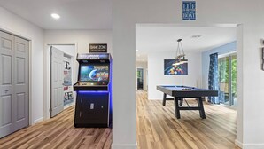 A room with a pool table, a game zone arcade, and a sign that says "Life is better on the boat." - Lakefront Retreat w/Pvt Dock, Game Room, Hot Tub (Murray)