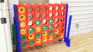 A colorful ring toss game setup on a wooden deck. - Lakefront Retreat w/Pvt Dock, Game Room, Hot Tub (Murray)