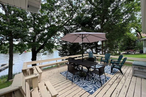 Beautiful and spacious deck with large grill and plenty of seating overlooking the water.