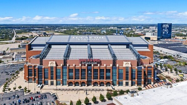 Lucas Oil Stadium with a large parking lot and a clear view of the surrounding area.