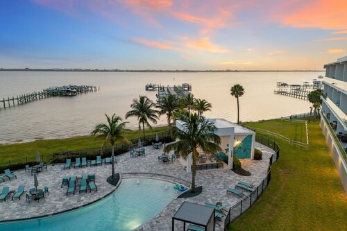 Sleek Coastal Condo with Stunning Riverfront Views and Luxury Amenities