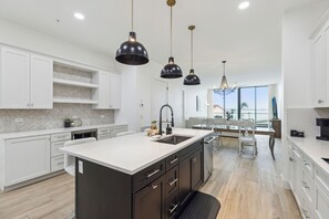 Fridge, microwave, oven, stovetop - Sleek Coastal Condo with Stunning Riverfront Views and Luxury Amenities (Melbourne Beach)