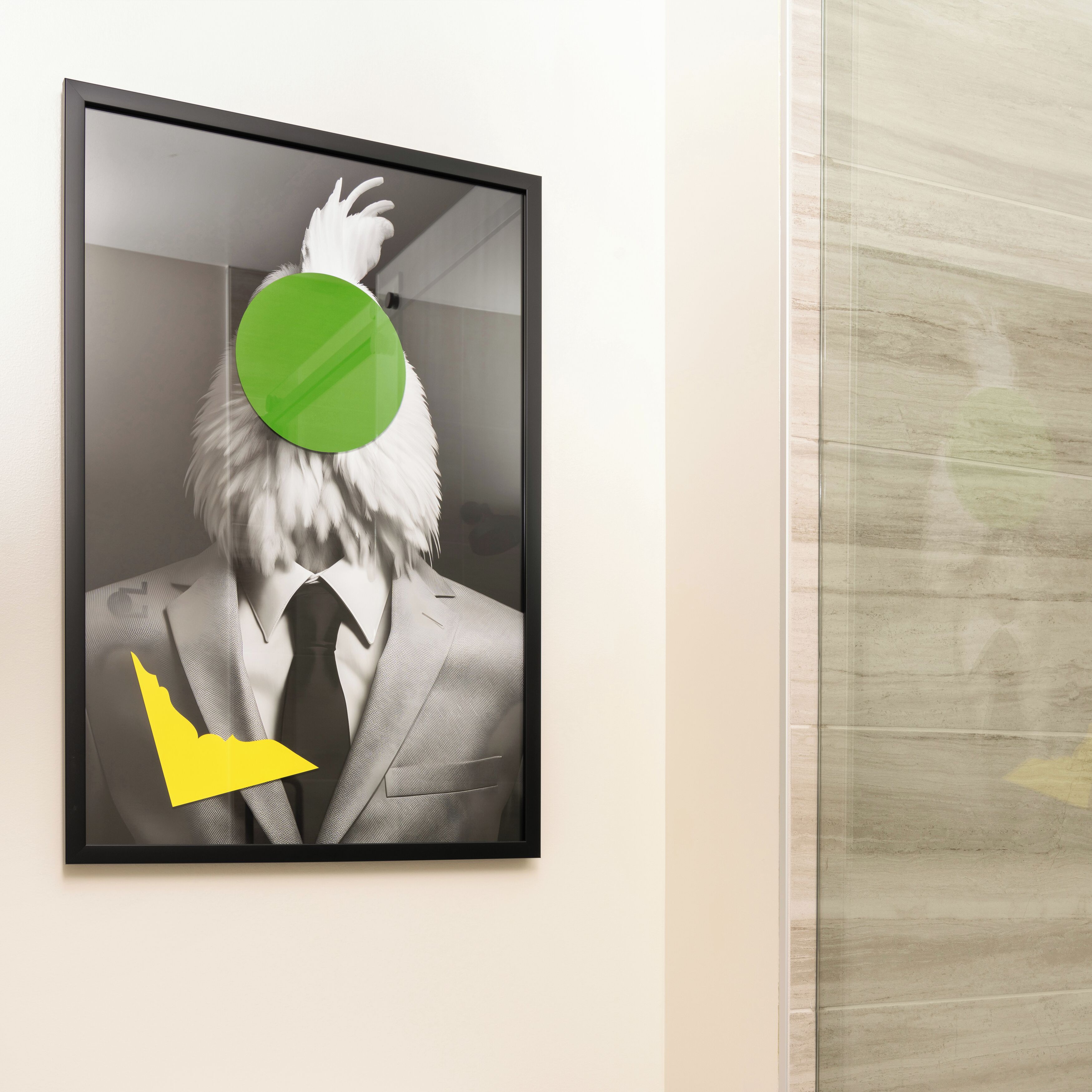 A framed artwork of a person in a suit with a green circle over the head and a yellow arrow pointing downwards.
