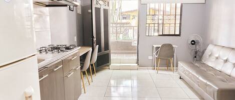 Apartment | Private kitchen | Full-size fridge, microwave, stovetop, cookware/dishes/utensils