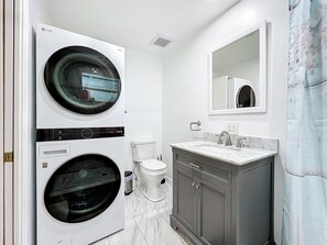 Shower, hair dryer, towels, soap
