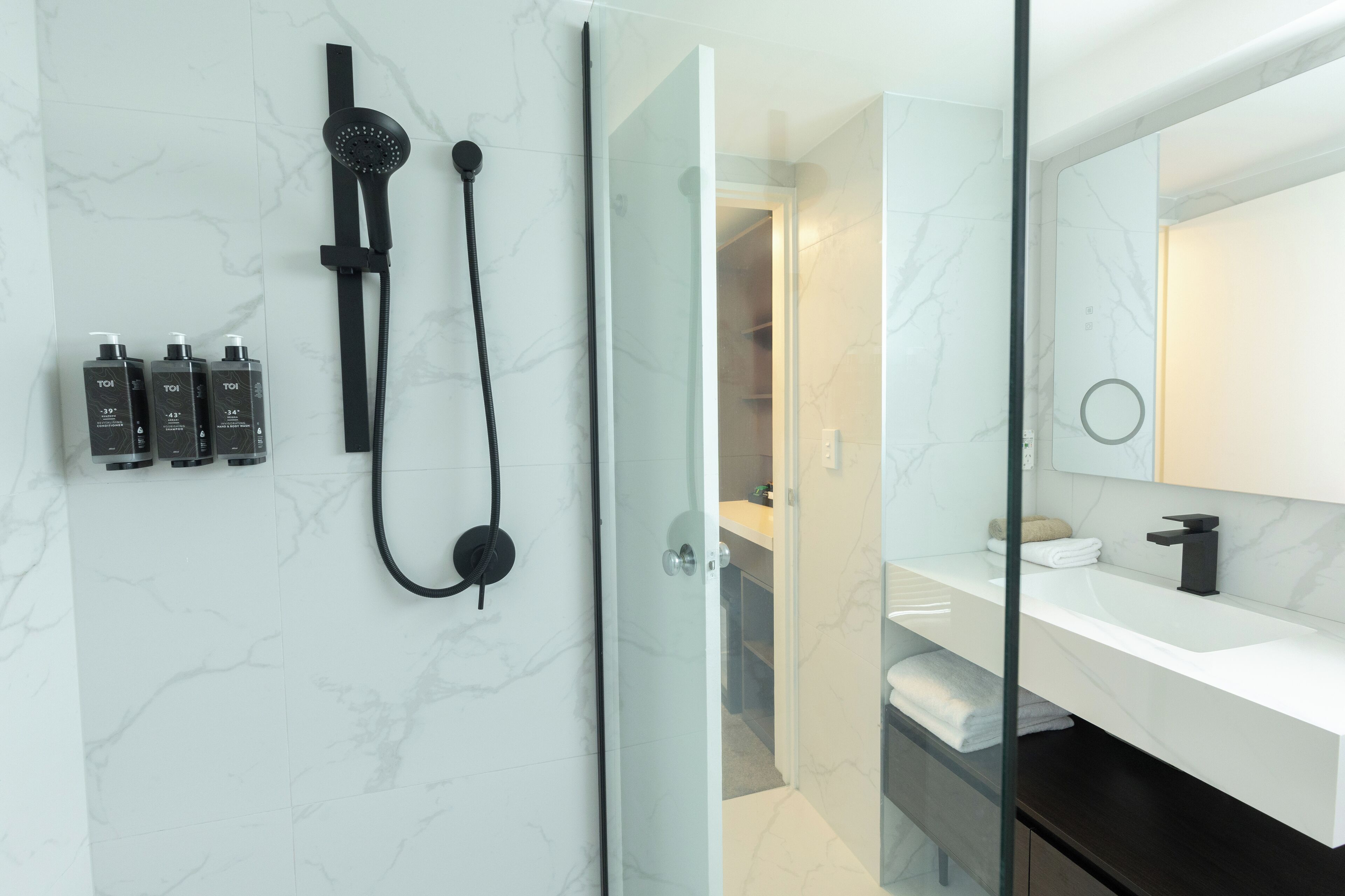 Shower, hair dryer, slippers, towels