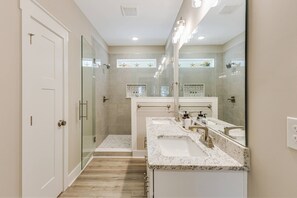 Shower, hair dryer, towels, shampoo