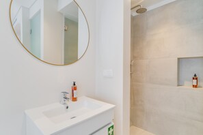 Shower, hair dryer, towels, toilet paper