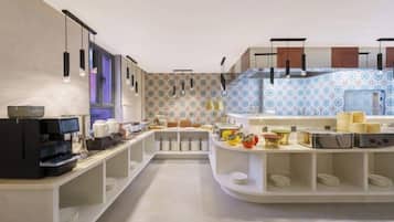 A modern kitchen with built-in appliances, a central island, and a patterned backsplash.
