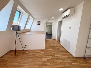 Superior Penthouse | Living area | 42-inch Smart TV with satellite channels, heated floors
