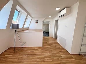 Superior Penthouse | Living area | 42-inch Smart TV with satellite channels, heated floors