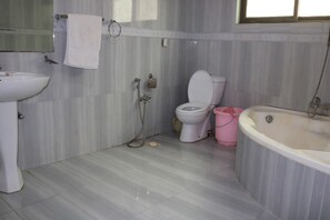 Triple Room | Bathroom | Slippers, towels, soap, shampoo - Overseas B&B Guest House (Islamabad)