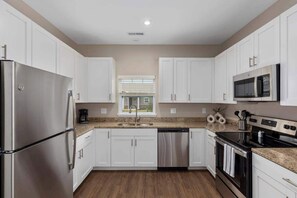 Coffee/tea maker, fridge, microwave, oven