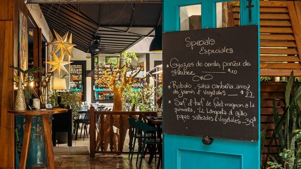 An interior view of a restaurant named 'CITRUS' with a chalkboard menu listing specials. - 3 bedrooms. Large pool. Gated. Private. Ojochal. (Ojochal)