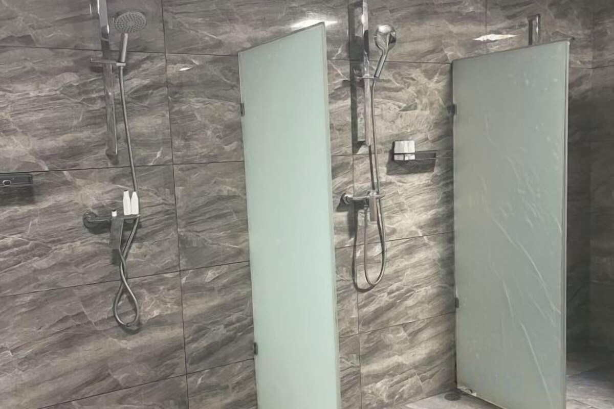 Bathroom | Shower, rainfall showerhead, hair dryer, slippers