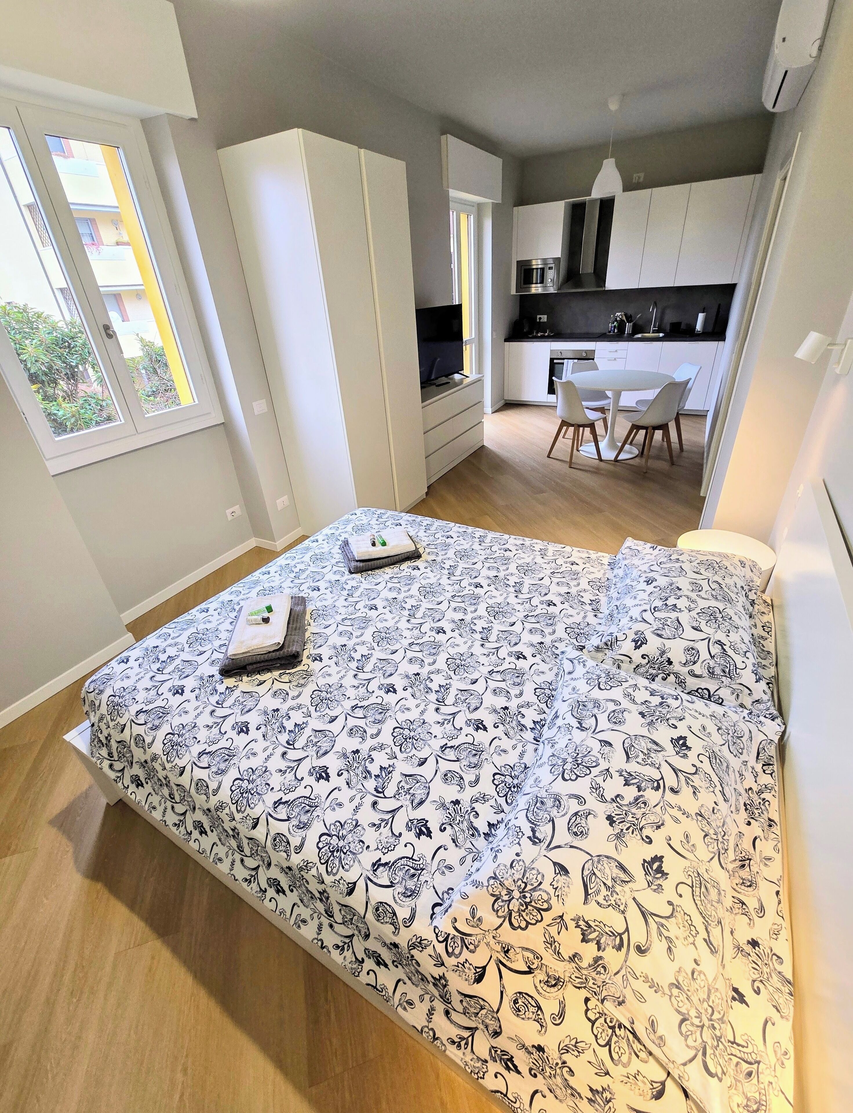 Frette Italian sheets, premium bedding, down duvets, laptop workspace