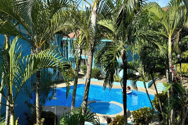 View of pool from second floor floor bedroom balcony