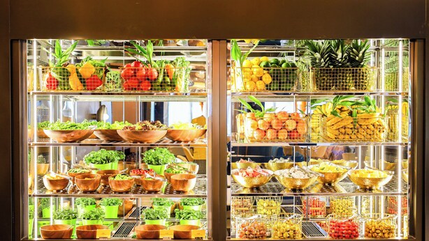 A refrigerated display case with various fruits and vegetables. - voco Shanghai Zhangjiang by IHG (Shanghai)