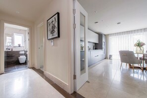 Enjoy meals in the spacious dining area with a table and chairs.
