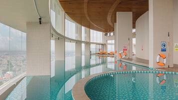 Swim and enjoy expansive city views from this indoor pool surrounded by large windows.