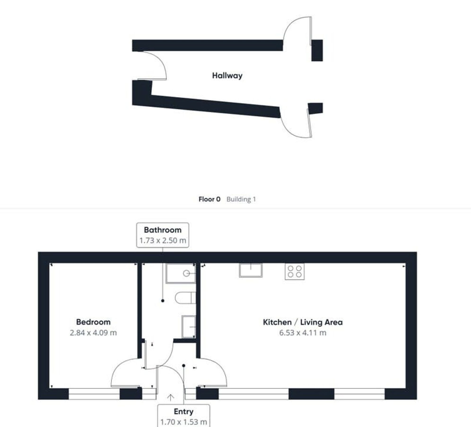 A floor plan of a building with a hallway, bathroom, bedroom, and kitchen/living area.