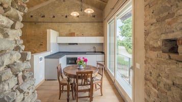Apartment, Garden View | Private kitchen | Fridge, cookware/dishes/utensils