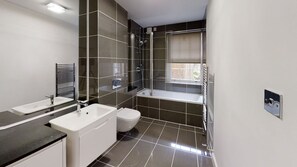 Apartment | Bathroom | Combined shower/tub, deep soaking tub, hair dryer, towels
