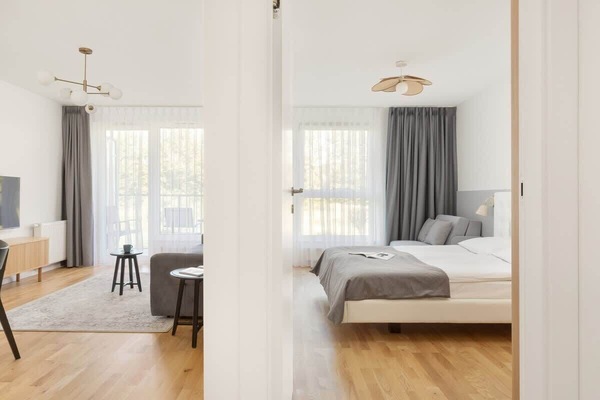 The bedroom's modern design ensures a comfortable stay.