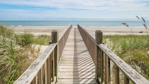 A wooden boardwalk leading to a beach with a clear sky. - Our Happy Place #170 Ocean & Sound Views, Hot Tub, Pool & Beach Access (North Topsail Beach)
