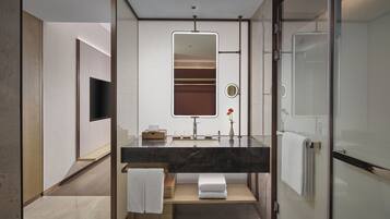 Designer toiletries, hair dryer, bathrobes, slippers