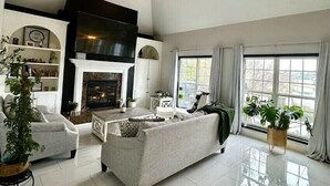 Living area - Lakefront Retreat with Stunning Pool. Near Ft. Eisenhower, & Augusta National. (Evans)