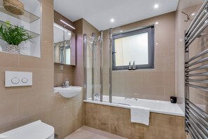 Hair dryer, towels, shampoo, toilet paper