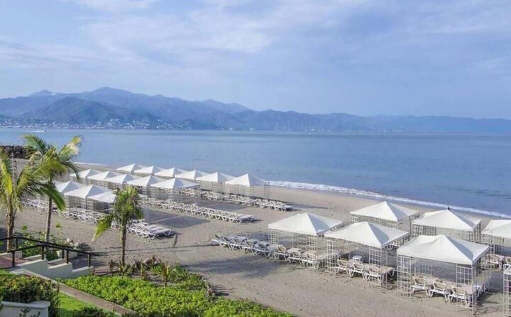 On the beach, sun loungers, beach towels