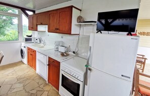 Enjoy cooking in this well-equipped kitchen with a microwave, coffee maker, toaster, and sink.