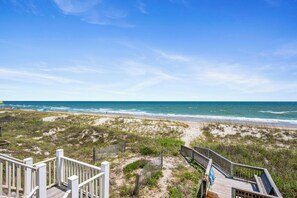 A wooden boardwalk leading to a beach with dunes and ocean views. - Oceanfront | 2 King Suites + Pool + Pet Friendly (Emerald Isle)