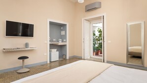 A hotel room with a bed, a TV, a small desk, a chair, a wardrobe, and a mirror. - Art Room n3 (Meta)