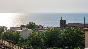 A coastal view with a tower, buildings, and trees. - Art Room n3 (Meta)
