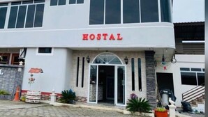 A two-story building with a sign reading "HOSTAL" at the entrance. - Royal Amazon (Coca)