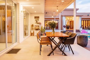 Enjoy meals at the dining table surrounded by comfortable chairs.