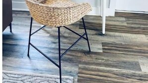 A white desk with a lamp and a woven chair in front. - 2BR Swamp Rabbit Getaway (Greenville)