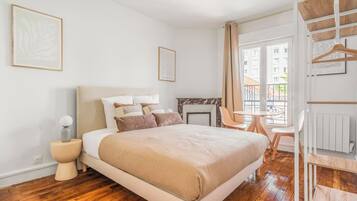 1 bedroom, desk, iron/ironing board, travel crib