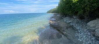 Rustic campground in De Tour Village with Large secluded lots. Site A
