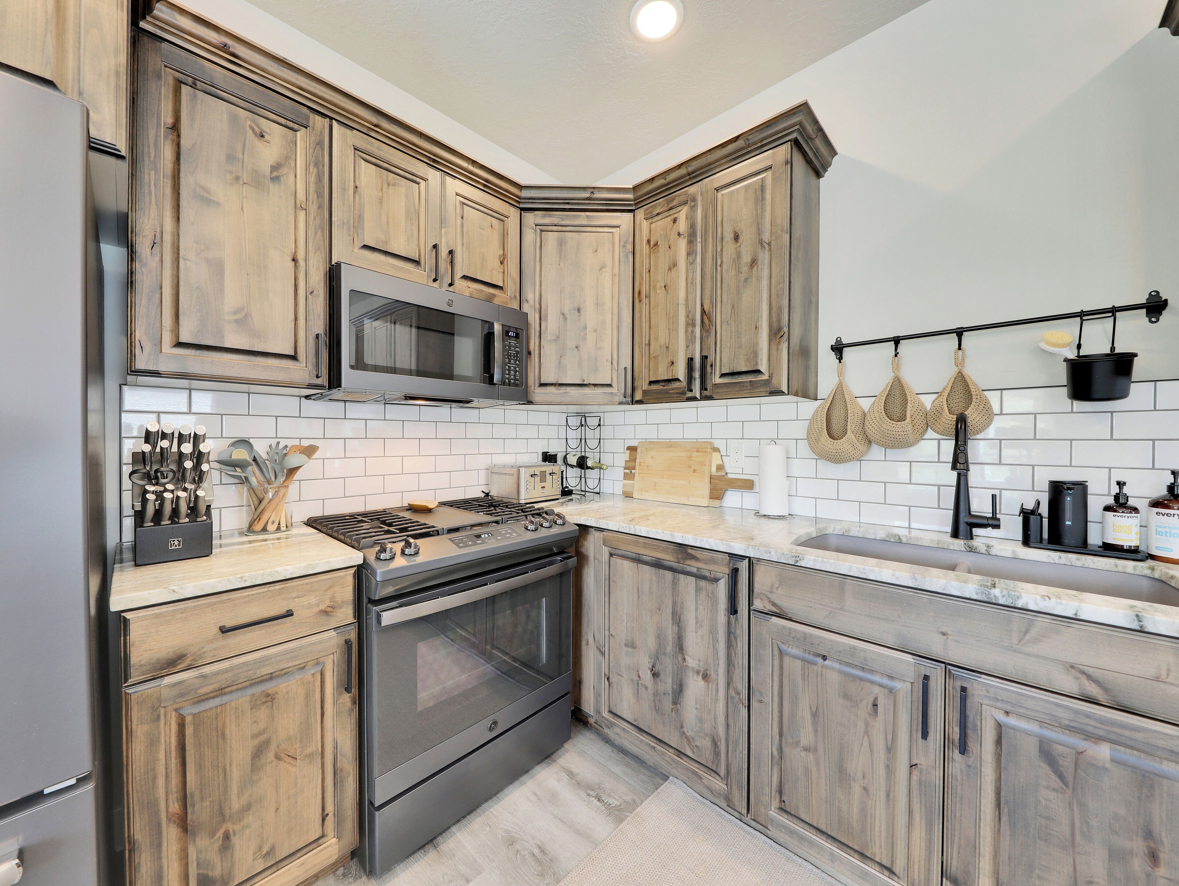 View of Fully Loaded Kitchen: The kitchen is fully equipped with high-end appliances and a spacious layout