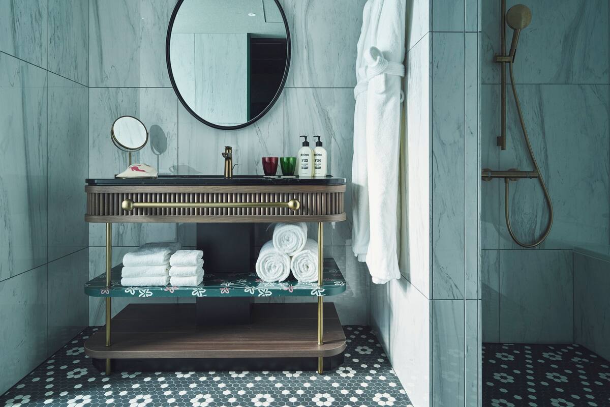 Separate bathtub and shower, hair dryer, bathrobes, slippers
