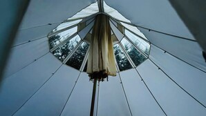 A tent with a central pole and a canopy.