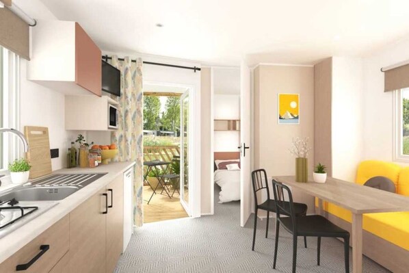 Réfrigérateur, four à micro-ondes, surface de cuisson